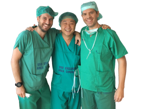 Dr Renaud Bollens with two surgical colleagues in scrubs